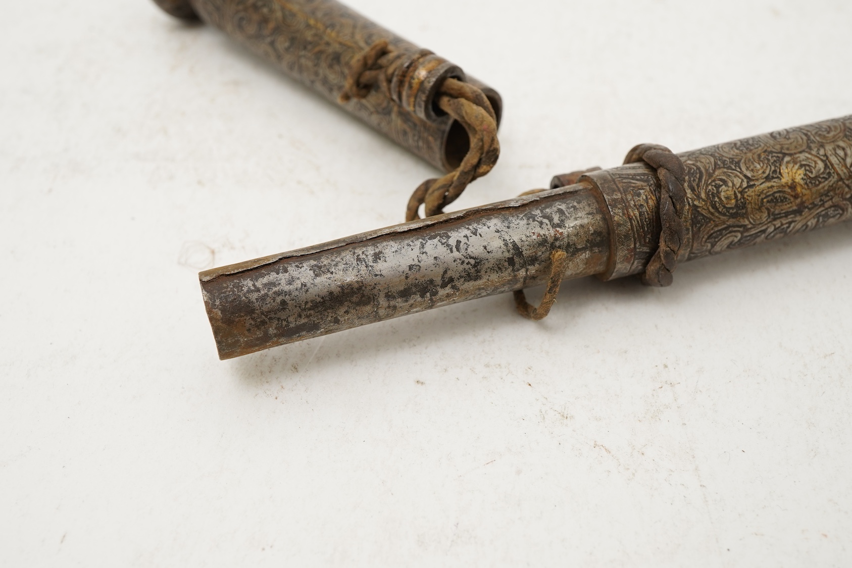 A Tibetan damascened iron scroll holder, 17th century